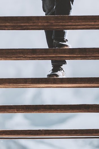 Person Wearing Black Leather Shoes 