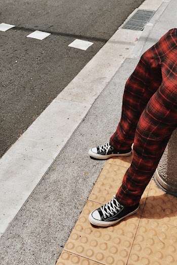 Person Wearing Black Low-top Sneakers