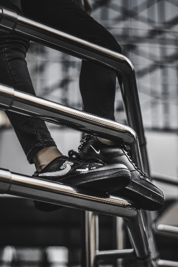 Person Wearing Black Low-top Sneakers