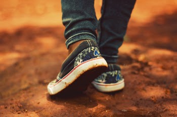 Person Wearing Black Low-top Sneakers and Black Jeans