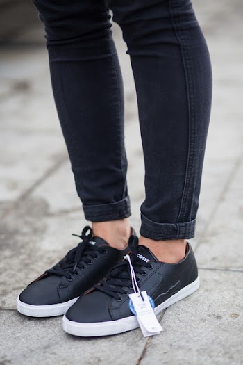 Person Wearing Black Pants And Pair Of Black Sneakers