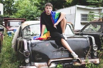Person Wearing Black Sitting on Old Vehicle