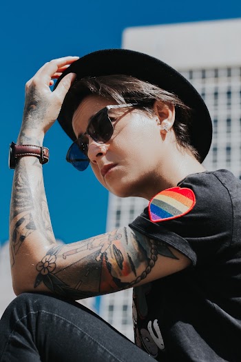 Person Wearing Black T-shirt and Hat