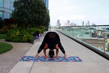 Person Wearing Black Tank Top Doing Yoga Position