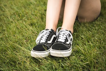 Person Wearing Black Vans Old Skool Skate Shoes