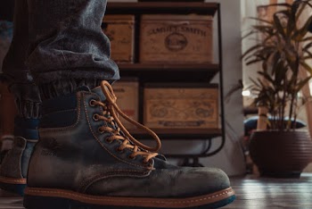 Person Wearing Black Work Boots