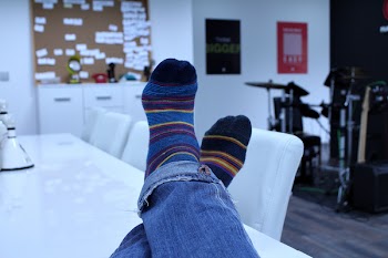 Person Wearing Blue Black Yellow Red Socks