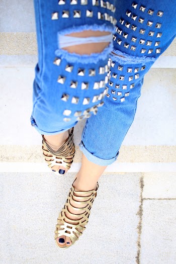 Person Wearing Blue Distressed Denim Jeans