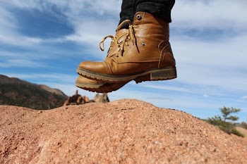 Person Wearing Brown Leather Work Boots during Daytime