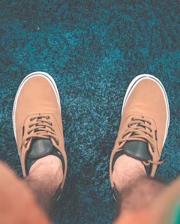 Person Wearing Brown Low Top Sneakers
