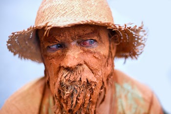 Person Wearing Brown Wicker Bucket Hat