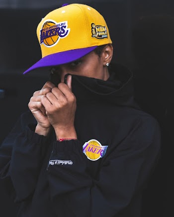 Person Wearing Cap and Hoodie