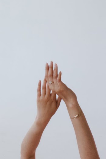 Person Wearing Gold Bracelet and Gold Ring · Free Stock Photo