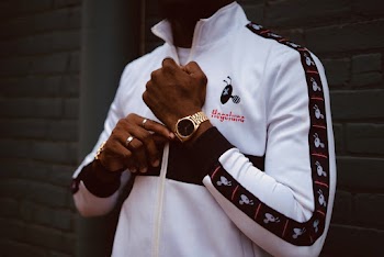 Person Wearing Gold-colored Analog Watch