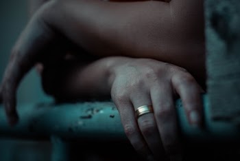 Person Wearing Gold-colored Ring