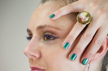 Person Wearing Gold-colored Ring Holding Face
