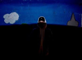 person wearing gray hooded top