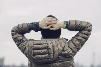 Person Wearing Gray Puff Jacket