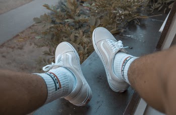 Person Wearing Gray Vans Oldskool