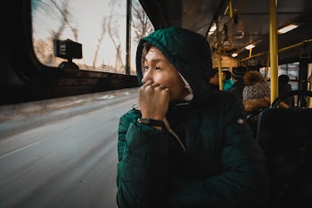 Person Wearing Green Hoodie