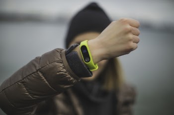 Person Wearing Green Xiaomi Band