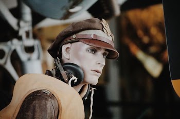 person wearing headphones and cap