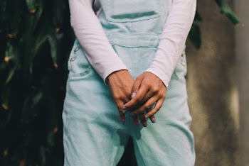 Person Wearing Long-sleeved Shirt and Teal Pants