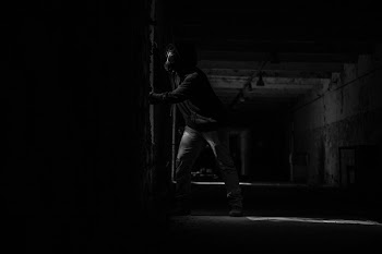 Person Wearing Mask Inside Dark Room