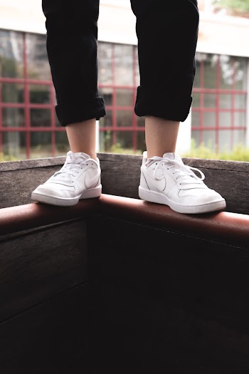 Person Wearing Nike Low-top Sneakers