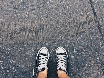 Person Wearing Pair of Black-and-white Converse All Star Low Sneakers