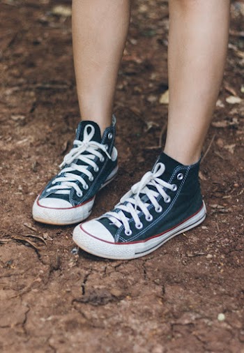 Person Wearing Pair Of Black Sneakers