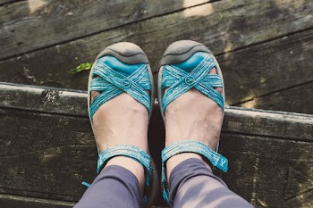 Person Wearing Pair of Blue Leather Sandals