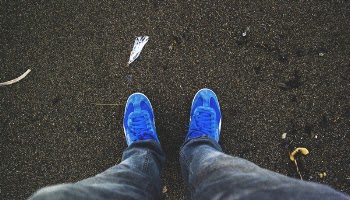 Person Wearing Pair of Blue Sneakers