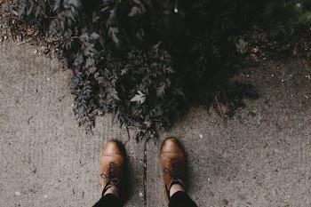 Person Wearing Pair of Brown Dress Shoes