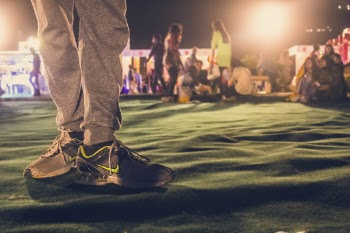 Person Wearing Pair of Gray Nike Running Shoes
