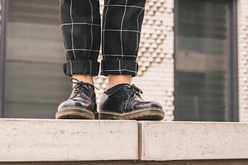 Person Wearing Pair of Leather Work Boots