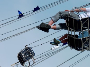Person Wearing Pirate Black Yeezy Boost 350 during Blue Sky