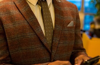 Person Wearing Red and Gray Plaid Suit Jacket