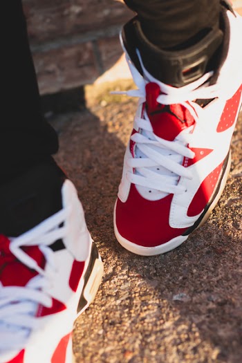 Person Wearing Red-and-white Basketball Shoes