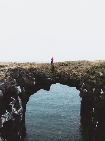 person wearing red pullover hoodie