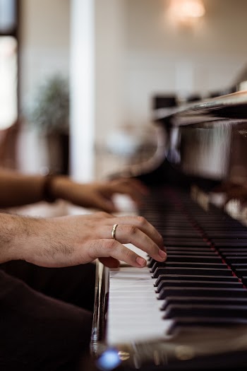 Person Wearing Ring Playing Piano