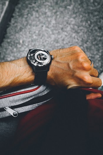 Person Wearing Round Black Watch