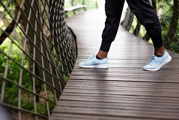 Person Wearing Rubber Shoes
