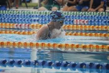 Person Wearing Swimming Goggles on Swimming Pool