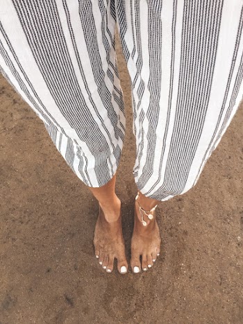 Person Wearing White and Grey Striped-up Pants