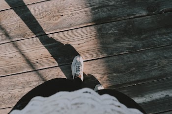 Person Wearing White Lace-up Shoes