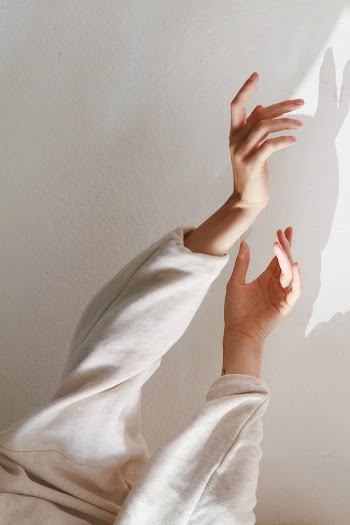 Person Wearing White Long-sleeved Top 