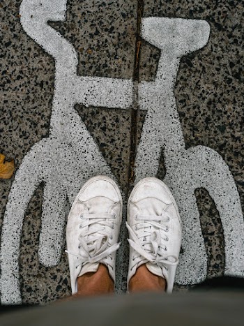 Person Wearing White Low-top Sneakers