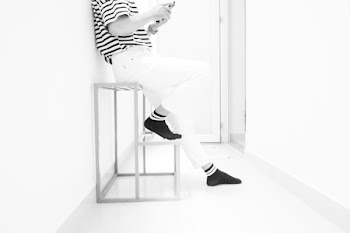 Person Wearing White Pants and Black Socks