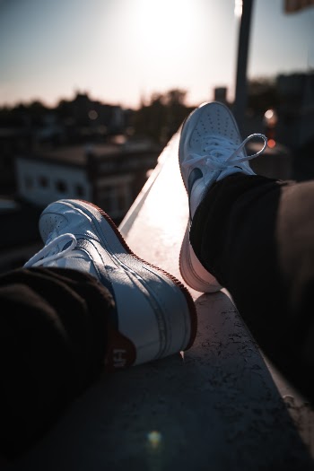 Person Wearing White Shoes